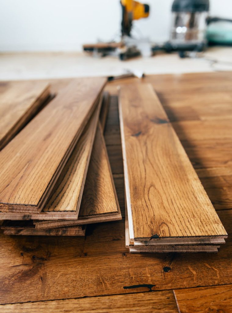 The process of house renovation with changing of the floor from carpets to solid oak wood. Beautiful golden handscraped oiled European oak brushed for added texture and fine definition of wood grain