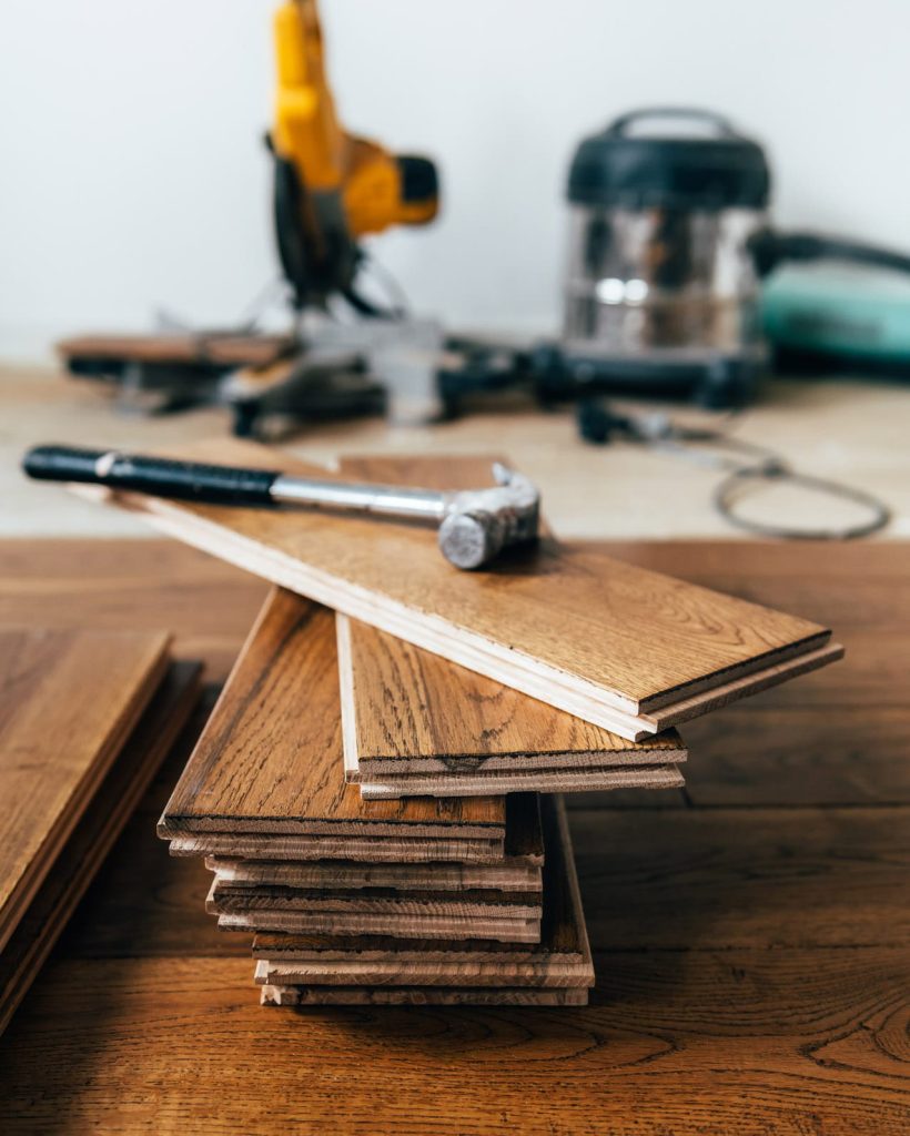The process of house renovation with changing of the floor from carpets to solid oak wood. Beautiful golden handscraped oiled European oak brushed for added texture and fine definition of wood grain